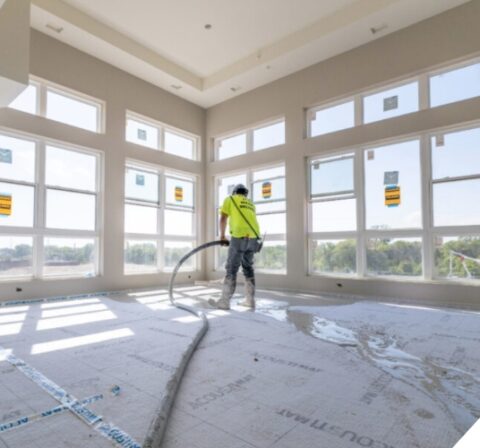 Structis contractor installing gypsum floor underlayment in a multifamily construction project in Minnesota.